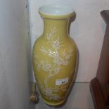 A Chinese yellow glazed vase decorated with birds and trees