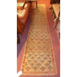 A fine North East Persian Turkoman carpet, 290cm x 168cm, repeating stylised eagle Kazak motifs on a