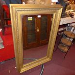 A C19th wall mirror the rectangular plate within ornate giltwood frame