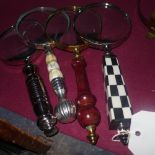 A group of four various magnifying glasses