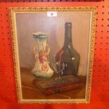 An oil on board still life study signed indistinctly, in a gilt frame