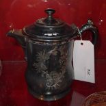 A silver plated claret jug with Rococo style engraving and scrolling style engraving and scrolling
