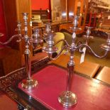 A pair of silver plated five branch candelabra