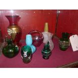 A collection of glass including green hand blown glass vases a Bohemian glass vase and others