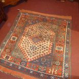 A Persian flatweave rug with central beige diamond medallion in a triple border