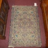 A pair of Persian rugs of small size, with floral and bird decoration