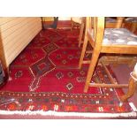 A fine South West Persian Lori carpet 235cm x 170cm, triple pole medallion on a rouge field