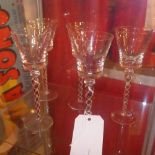 A set of five wine glasses with opaque twist stems