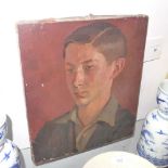 An unframed Percy Horton oil on canvas portrait of a young man, details to verso (a/f)