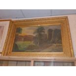 An oil on canvas landscape scene of large size, signed indistinctly, in an ornate gilt frame