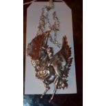 A sterling silver unicorn pendant on a silver chain