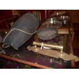 A wicker lidded basket and a brass door handle