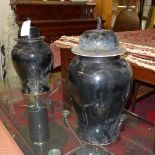 A pair of blue temple jars with lids