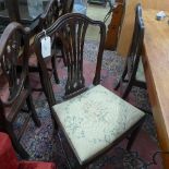 A pair of C19th Hepplewhite design mahogany pierced back side chairs with needlework seats on