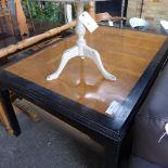 A Chinese burr elm and ebonised extending dining table with two extra leaves