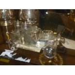 A silver plated cruet set in the form of