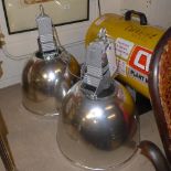 A pair of holophane industrial lights