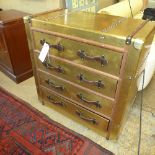 An aviator design gilded chest having four drawers with leather handles
