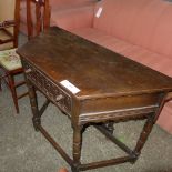 A C20th oak credence table with drop fla