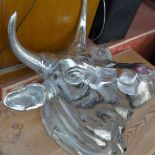 A chromium wall mounted bulls head