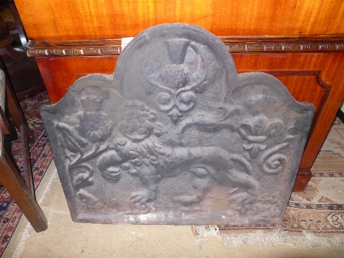 A late C18th cast iron fireback with fle