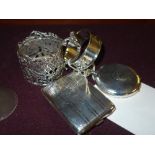 A silver card case, silver napkin rings,