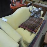 A Chippendale design camel back sofa upholstered in yellow fabric