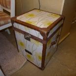 A pair of leather and daffodil pattern steamer trunks