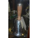 A silver plated cocktail shaker in the form of a bell