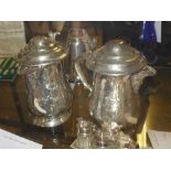 A pair of embossed silver plated tankards