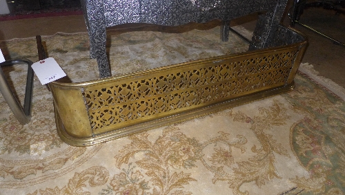 A C19th pierced brass fender W 94 H 22 cm