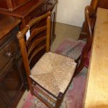 A group of four C19th chairs including a Hepplewhite style and a ladder back with rush seat