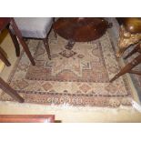 A Persian type rug the beige ground with geometric decoration