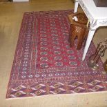A hand knotted Persian tekke rug the red