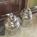 A pair of silvered ginger jars