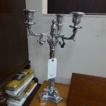 A pair of silver plated three light candelabra's on triform base