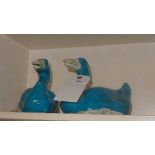 A pair of blue porcelain ducks