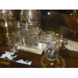 A silver plated cruet set in the form of a car