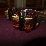 A pair of amber style bracelets