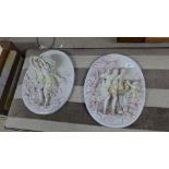 A pair of Meissen style wall plaques of family scenes