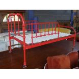 A C20th red painted childs single bedste