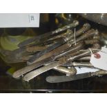 A collection of silver handle butter knives