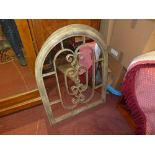 A pair of distressed wrought iron mirror