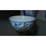 A Chinese Doucai cup with floral painted