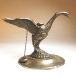 A Spanish silver plated brandy glass warmer, in the form of a swan, with outstretched wings, on an