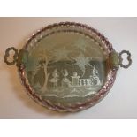 A C20th Venetian circular tray, the etched centre depicting a courting couple in a country setting