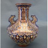 A C19th Hispano-Moorish lustre twin handled vase, the cream glaze with repeating geometric motifs in
