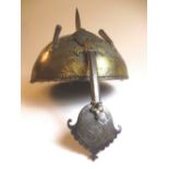 An C18th Persian steel helmet, with central spike and twin plume holders, nasal bar, with allover