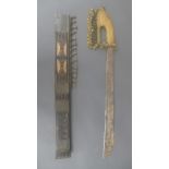 An East Asian ceremonial sword, the gilt metal hilt cast with repeating geometric decoration, the