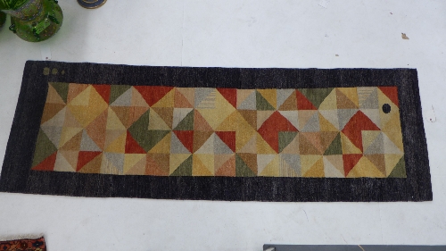 A Persian Shiraz hand woven contemporary runner with repeating multi-coloured geometric design